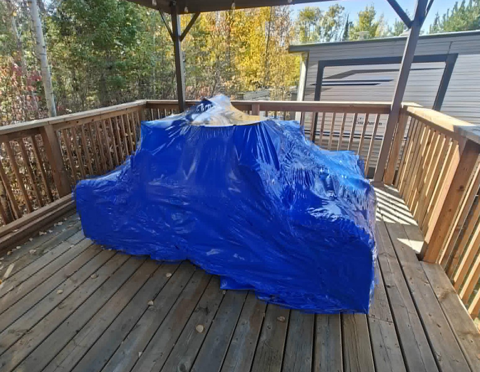 Patio furniture protected with custom shrink wrapping